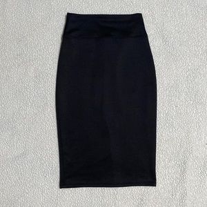 Size small pencil skirt with slit in the back.